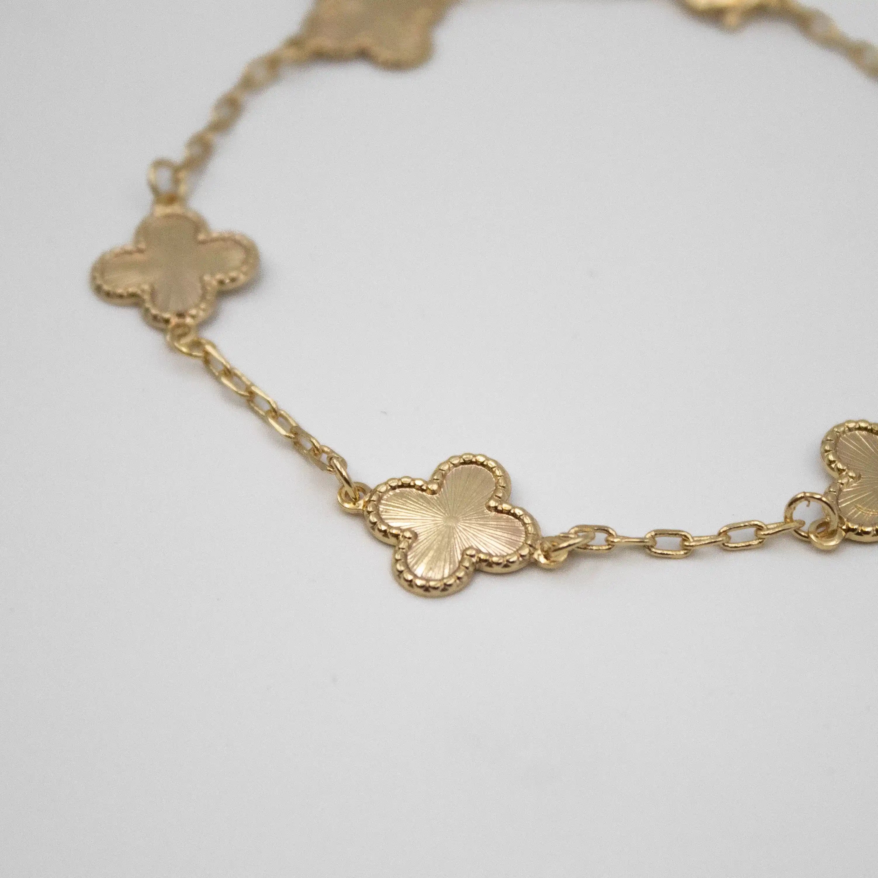 PULSEIRA 5 TREVOS FRISO BANHADO A OURO 18K